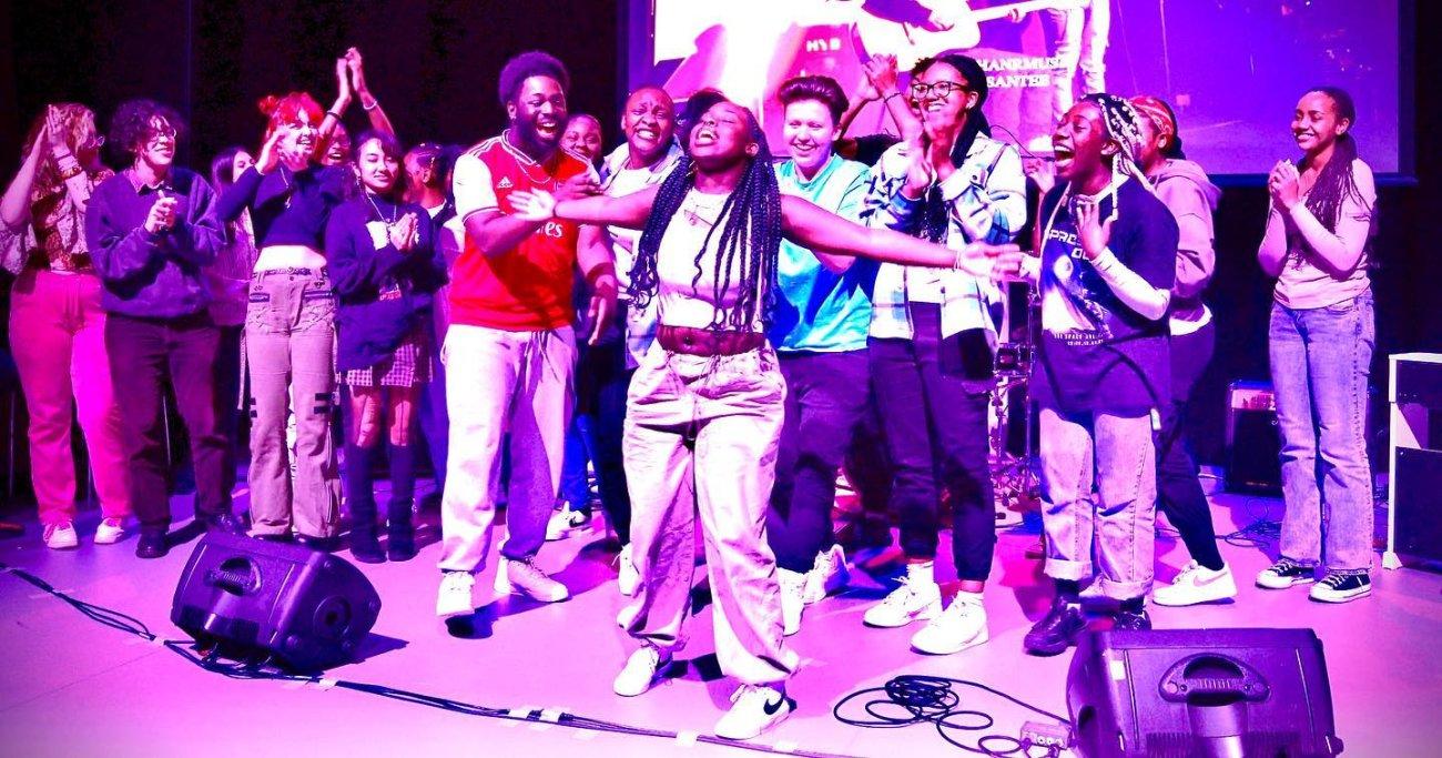 Young creatives celebrating together at a music showcase
